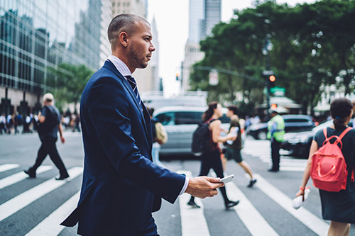 side-view-confident-businessman-passing-crosswalk