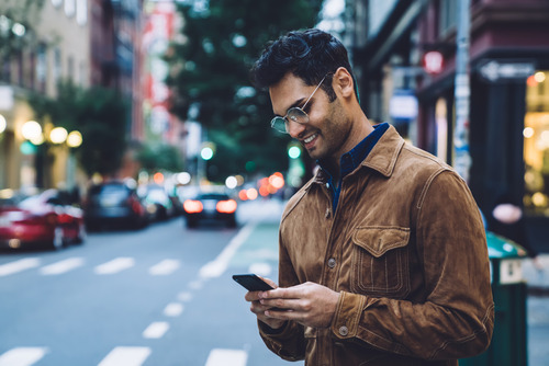 man looking at his phone