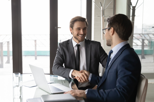 Two businessmen having an interview and talking about strengthening talent retention strategy by embracing career mobility