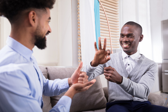 two people talking in sign language