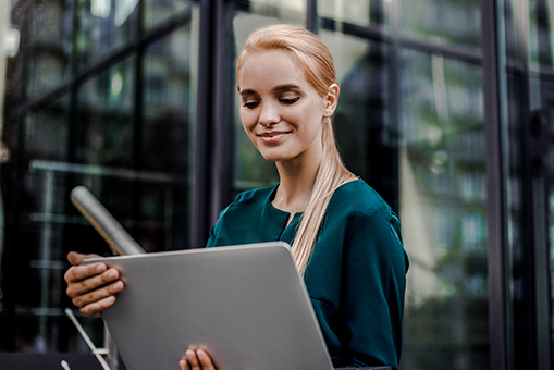 woman holding laptop