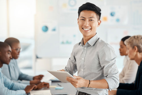 Businessman smiling in a team meeting