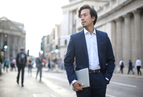 businessman holding a laptop