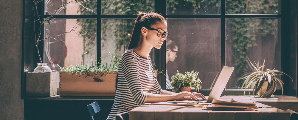 Picture of female working on notebook in home office