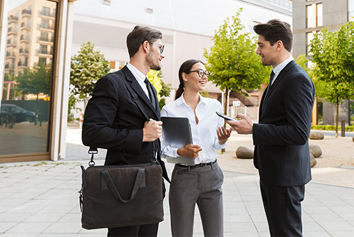 Two men and woman talking