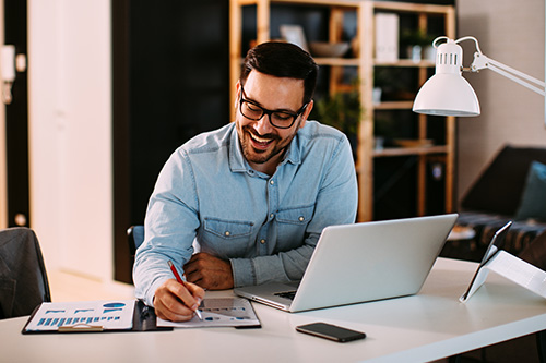 young-business-man-working-home-laptop