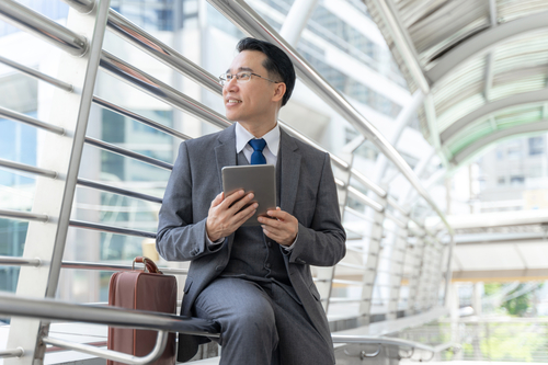 businessman holding a tablet