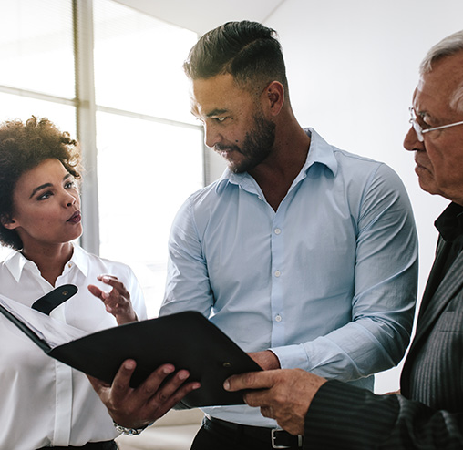 Business team discussing over a business report